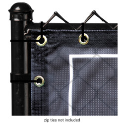 Close up of corner of banner attached to a fence